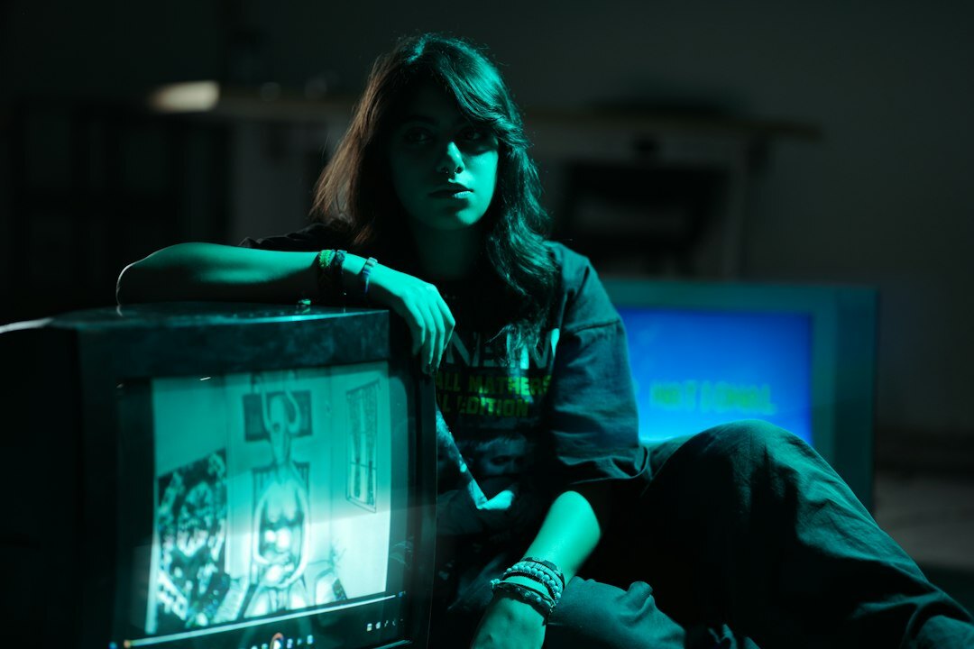 Vintage television set glowing in a dark studio